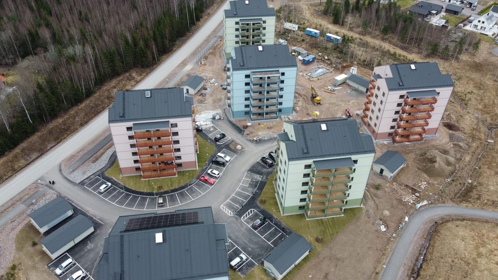 Aerial view of newly built apartment blocks surrounded by forest in Åmål, Sweden.